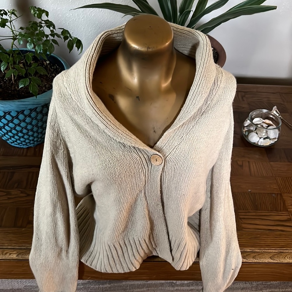 Super cute sweater with one button. Heavier weight. Great layering piece